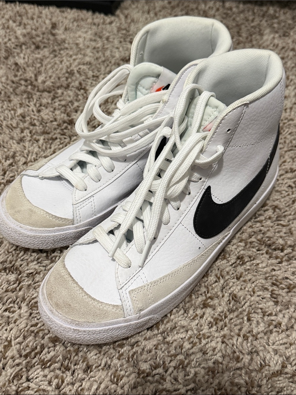 Nike White High-Top Sneakers with Black Swoosh